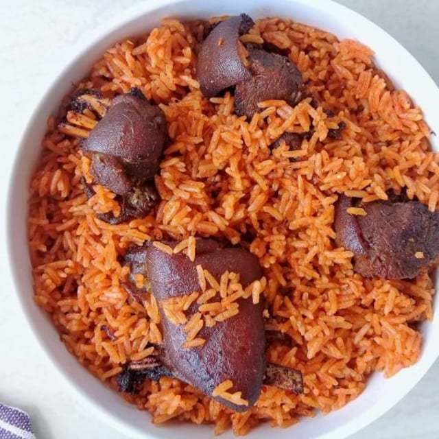 Jollof Rice W/ Fried Goat.