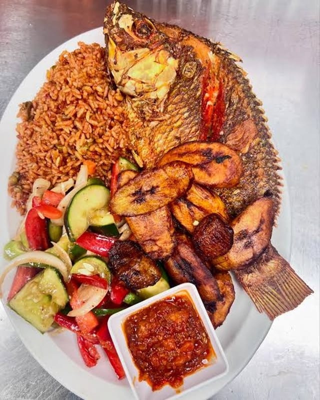 Jollof Rice W/ Fried Tilapia.