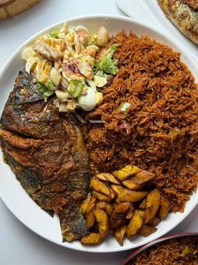 1/2 Jollof & 1/2 Waakye Grilled Tilapia.